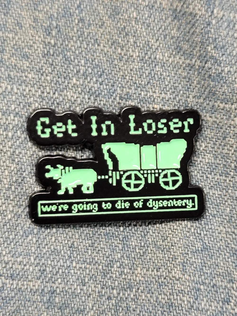 The Oregon Trail Pin, Get In Loser Enamel Pin - Black and Neon Green